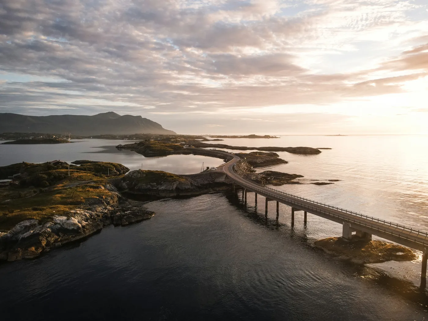 Coastal road bridge at sunset